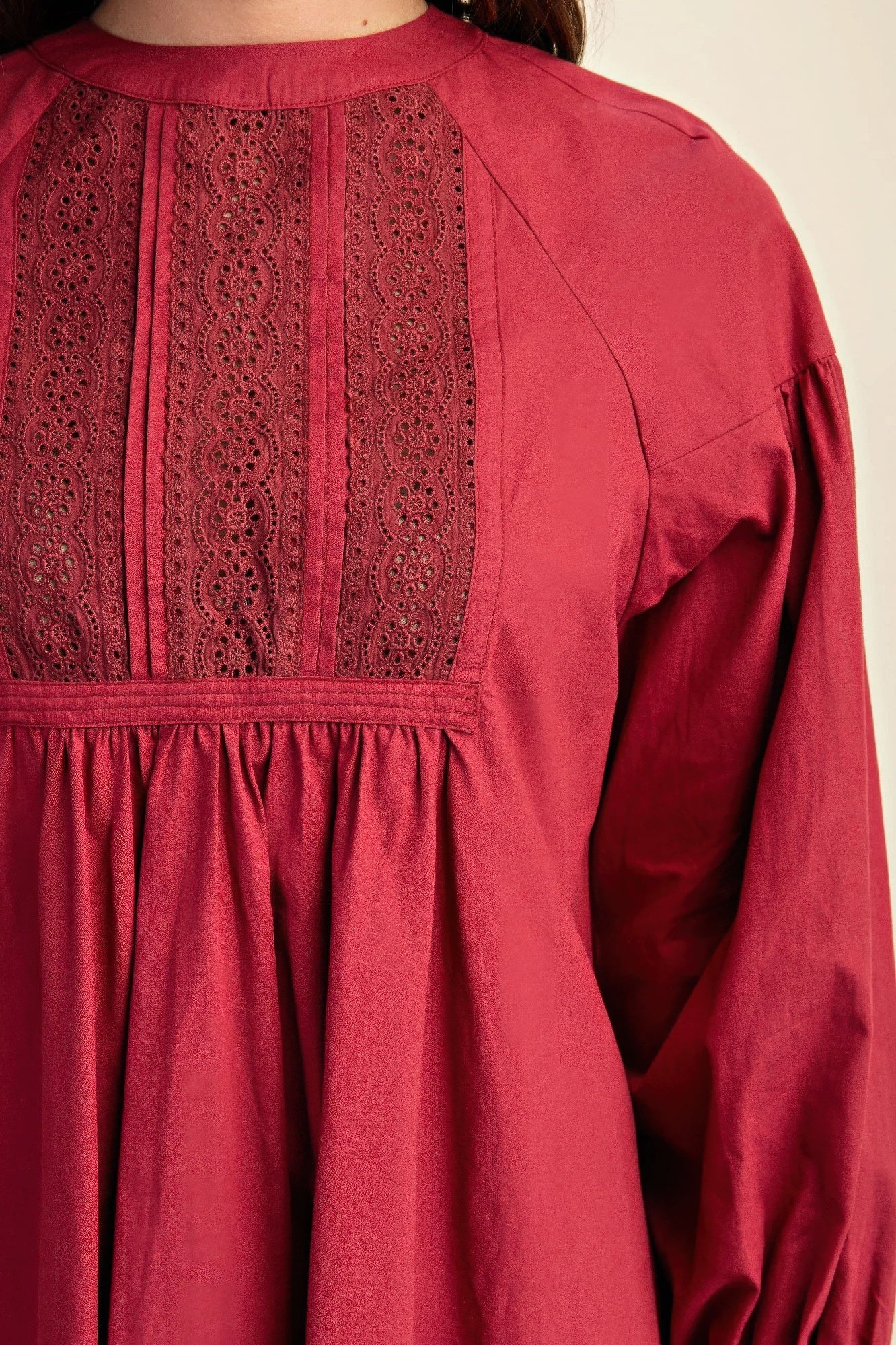 Plum lace yoke mini dress detail, buttoned back and gathered waistband