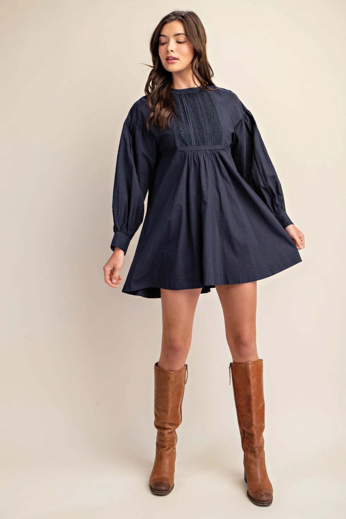 Navy long-sleeve mini dress with lace yoke, puff sleeves, and flare skirt