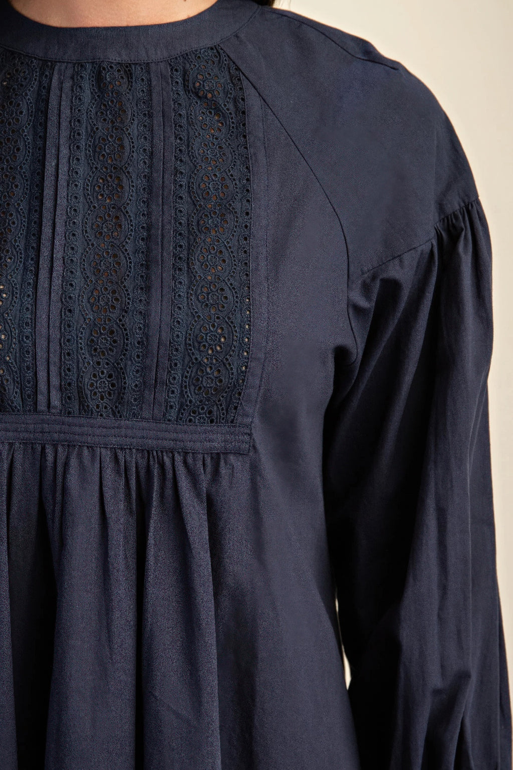 Navy long-sleeve mini dress with lace panel bodice and gathered waist