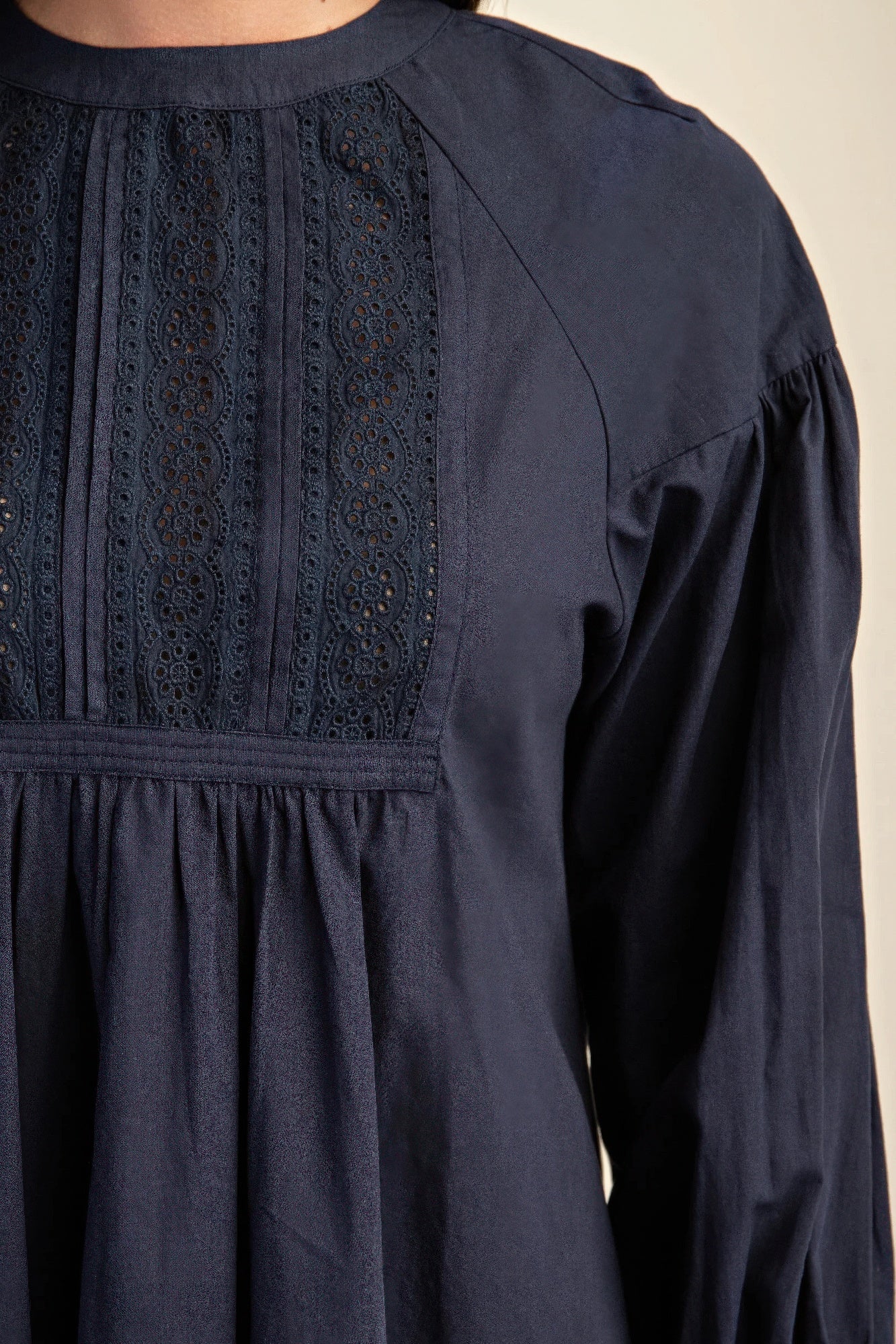 Navy long-sleeve mini dress with lace panel bodice and gathered waist