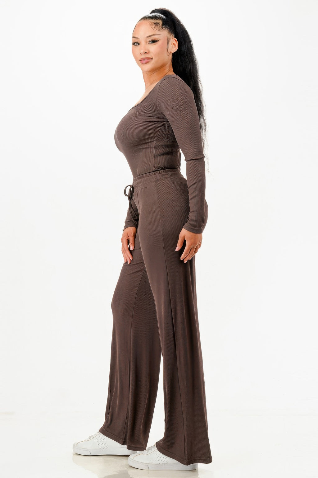 Side view of ribbed long-sleeve bodysuit and matching wide-leg pants, dark brown