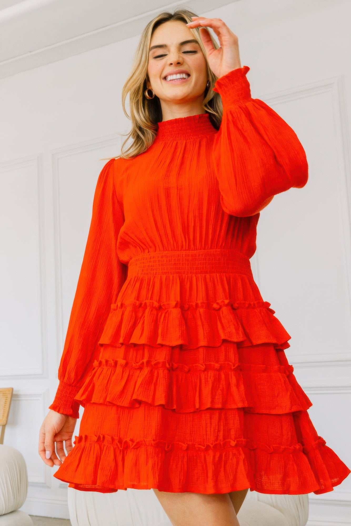 Long sleeve mini dress with smocked neck and layered ruffle tiers in red