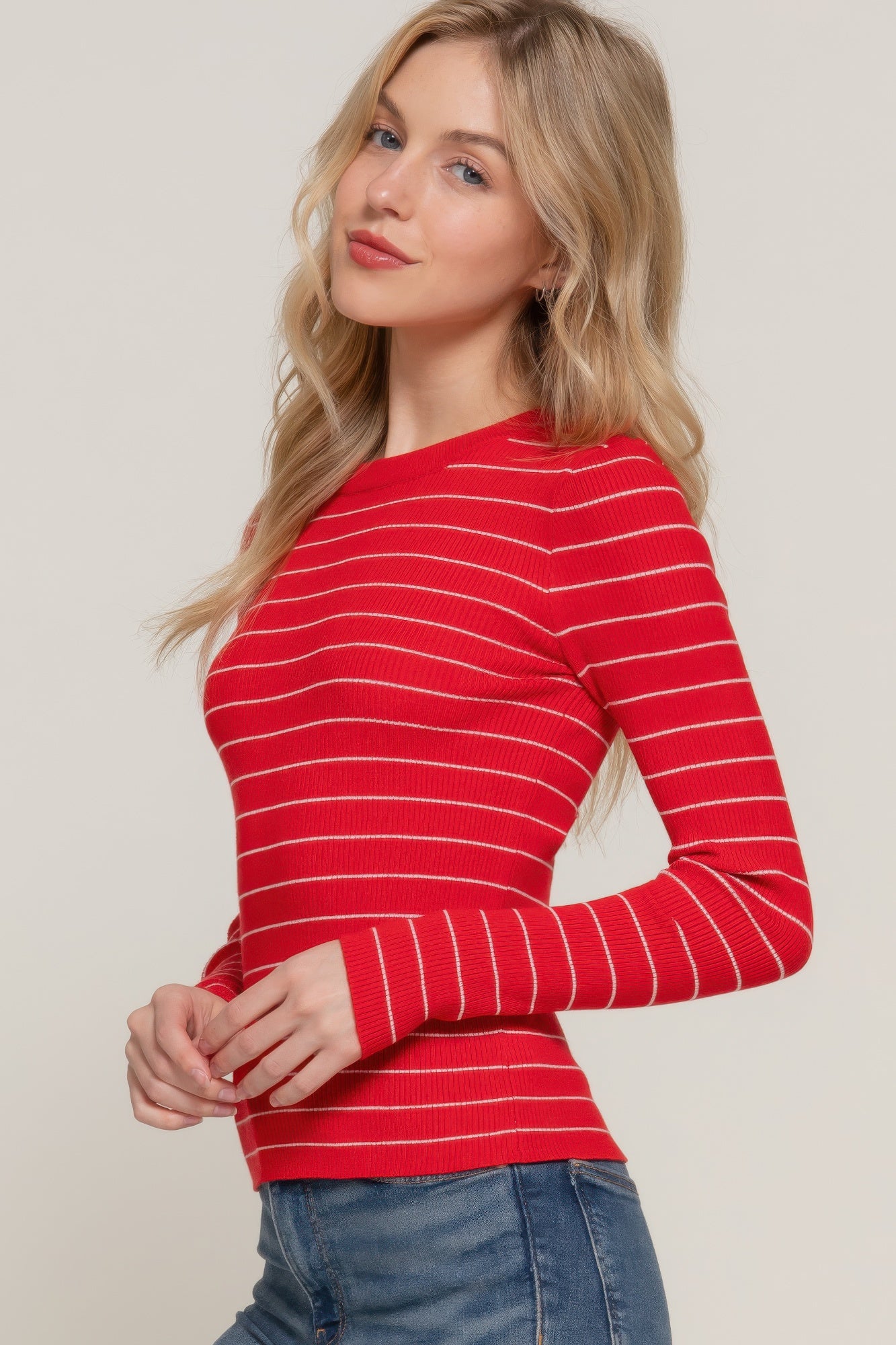 Red-and-white striped long sleeve crew neck knit sweater, close-up of neckline