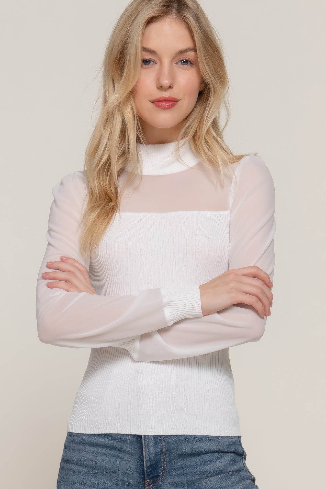 Off-white long-sleeve sweater top with mesh panel detail and ribbed cuffs