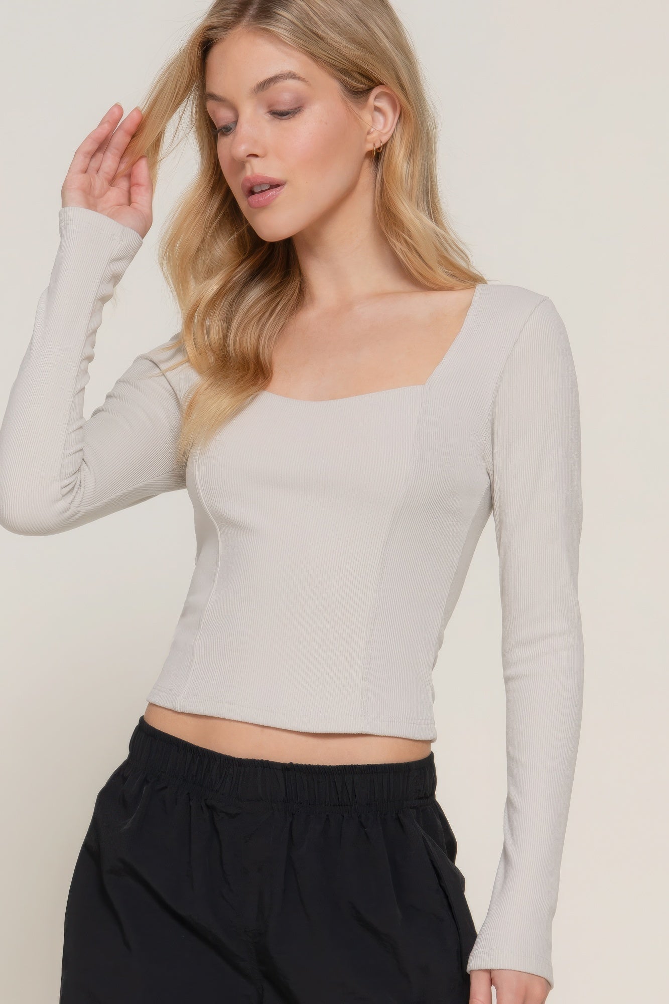 Sweetheart neck knit top with seam detail, long sleeves, light color