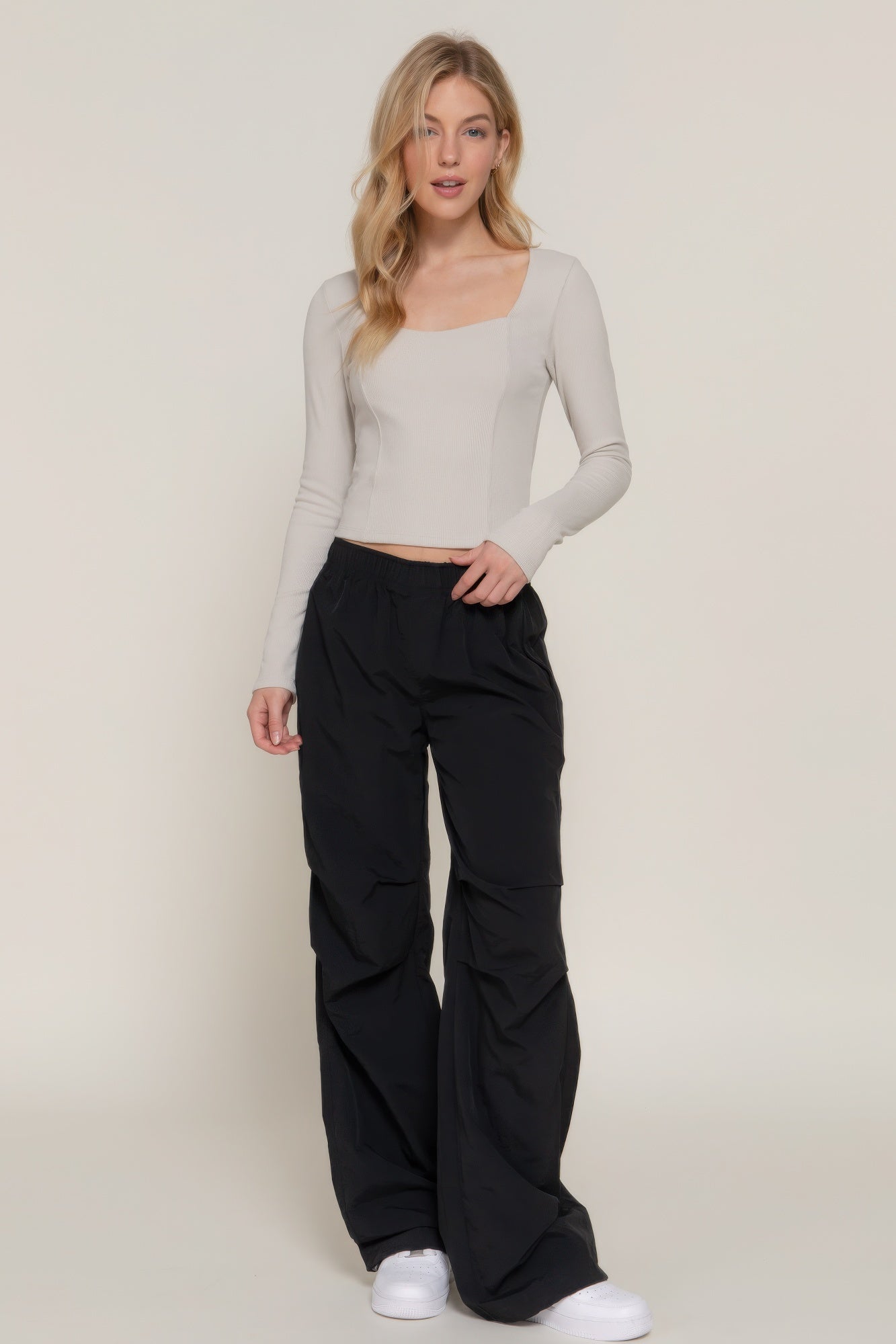 Long-sleeve knit top with sweetheart neckline and seam detail, light color
