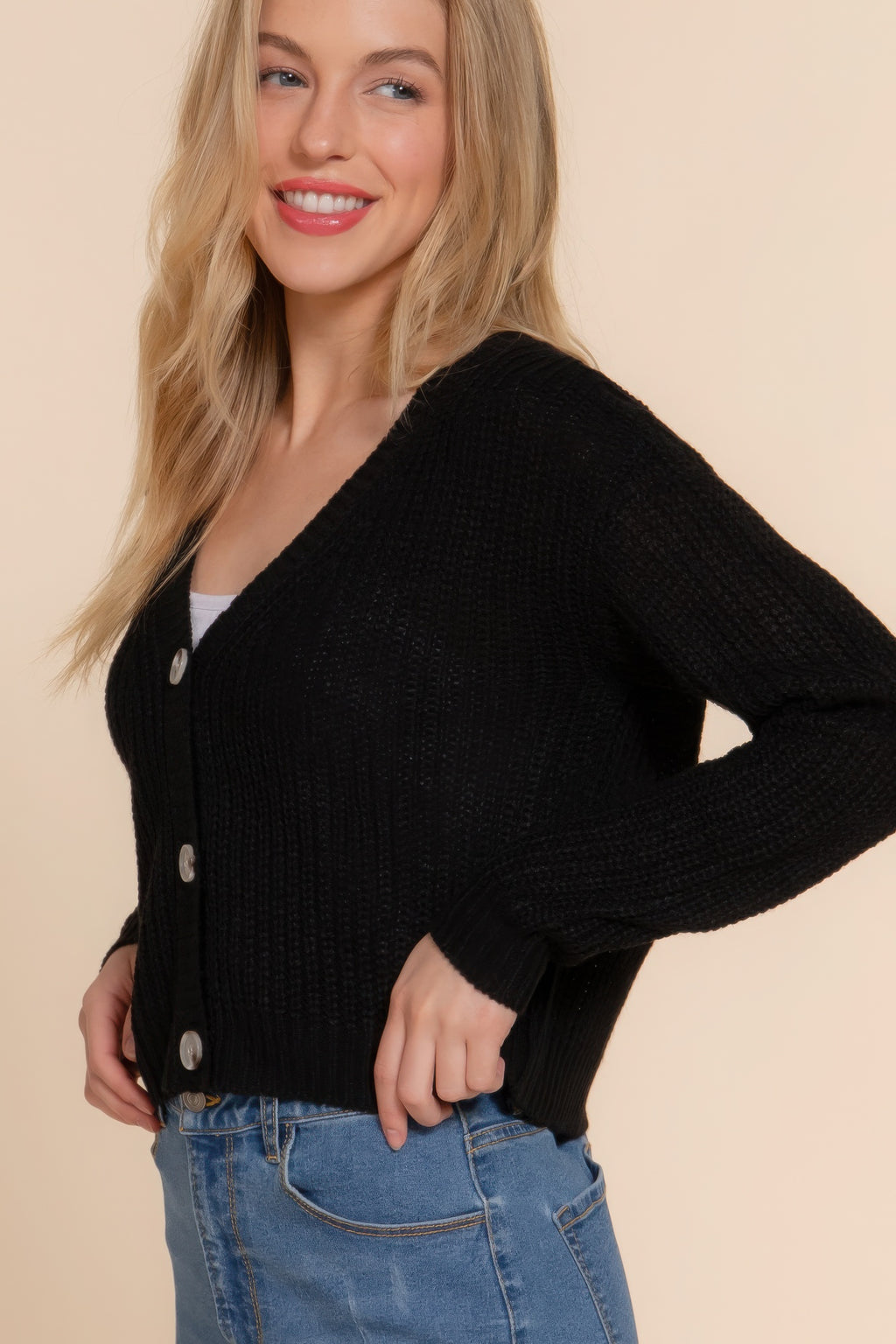 Black knit V-neck cardigan with silver button closures and long sleeves