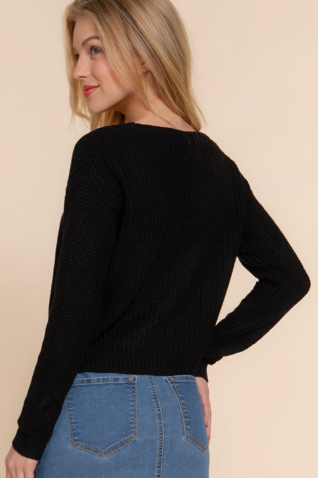 Black knit cardigan back view with long sleeves and ribbed waistband