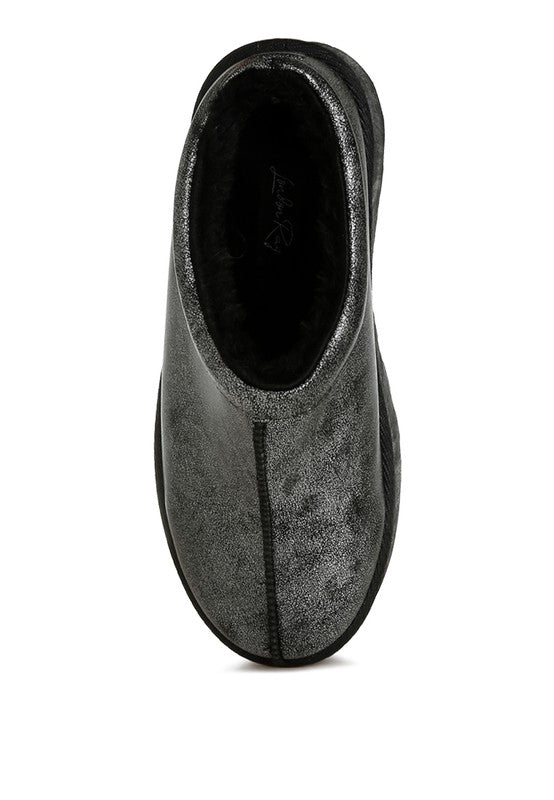 Black slip-on platform mule with faux-leather finish and fuzzy interior lining