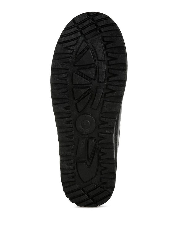 Black platform slip-on shoe outsole with textured tread pattern