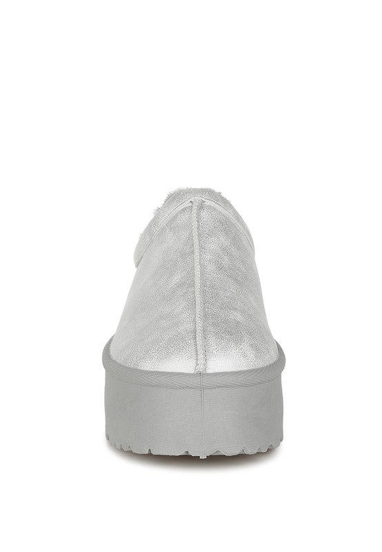 Light silver slip-on platform shoe heel view with chunky sole and seam detail