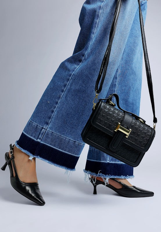 Black slingback kitten heels with pin-buckle ankle strap and slim heel