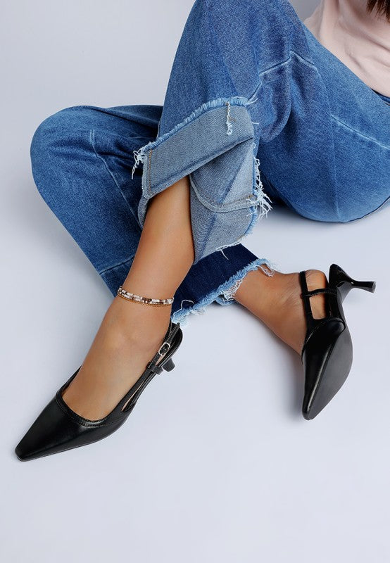 Black pointed-toe slingback kitten heels with ankle strap and pin buckle