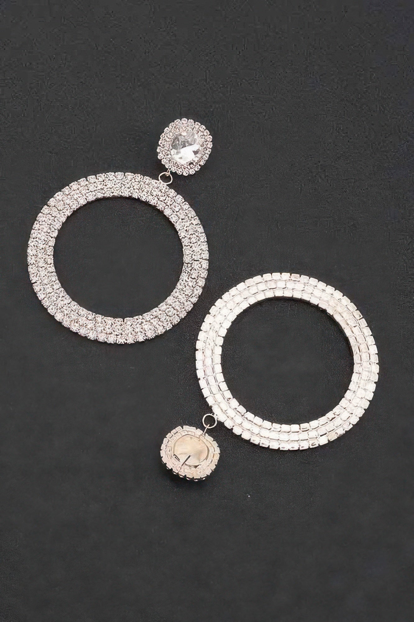 Silver-tone circular rhinestone hoops with large inner ring and small hanging charm