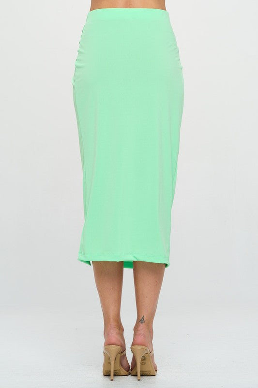 Neon green midi skirt with ruched knot waistband and straight hemline