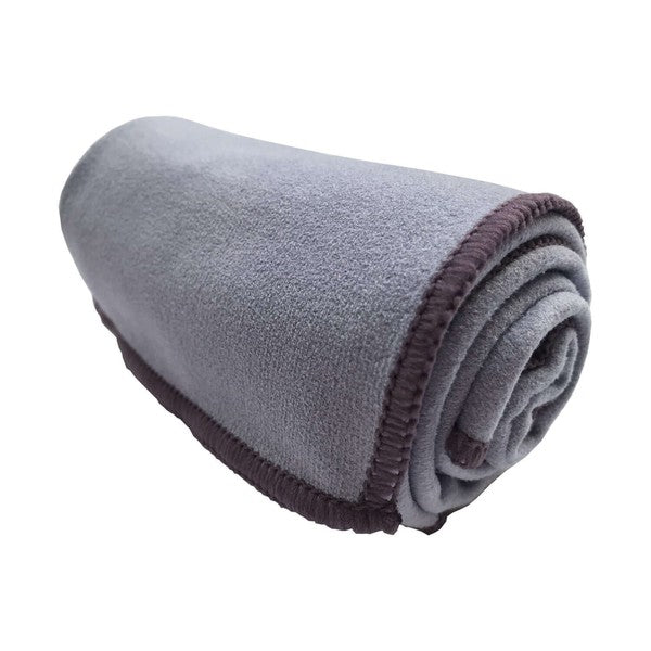 Rolled lavender hand towel with dark trim and layered terry texture