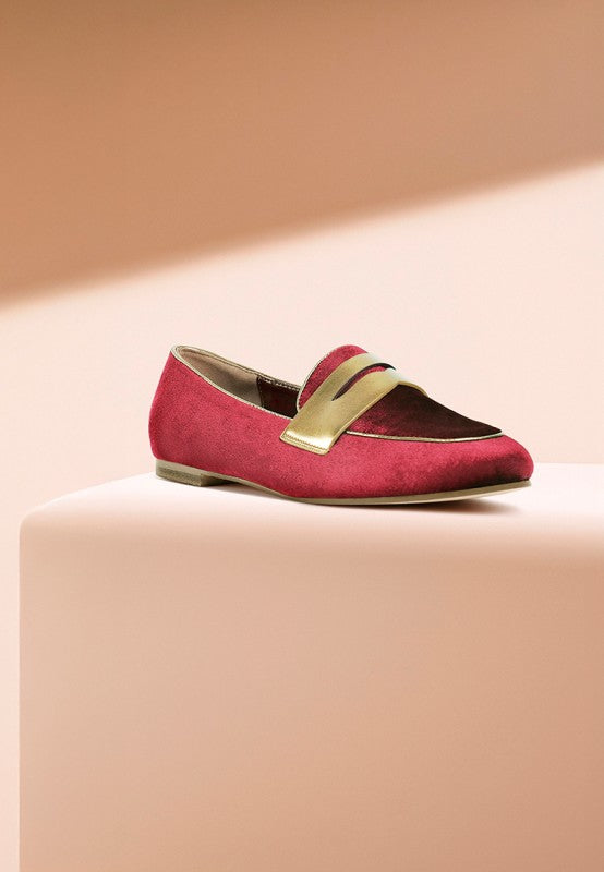 Burgundy velvet loafer, side view, with contrasting metallic penny strap