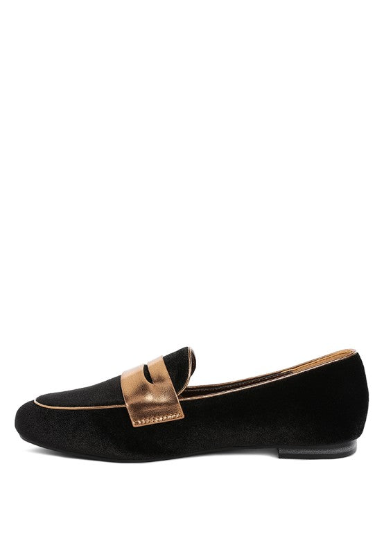 Black velvet loafer, side profile, contrasting metallic penny strap, flat sole