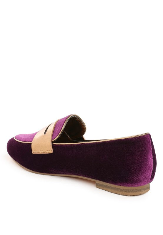 Purple velvet slip-on loafer with metallic strap detail and low flat sole