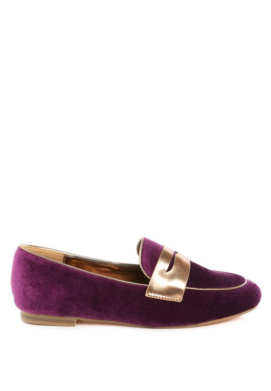 Purple velvet penny loafer with contrasting metallic strap and tan outsole