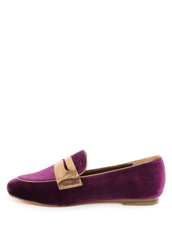 Side view of purple velvet penny loafer with metallic strap and round toe