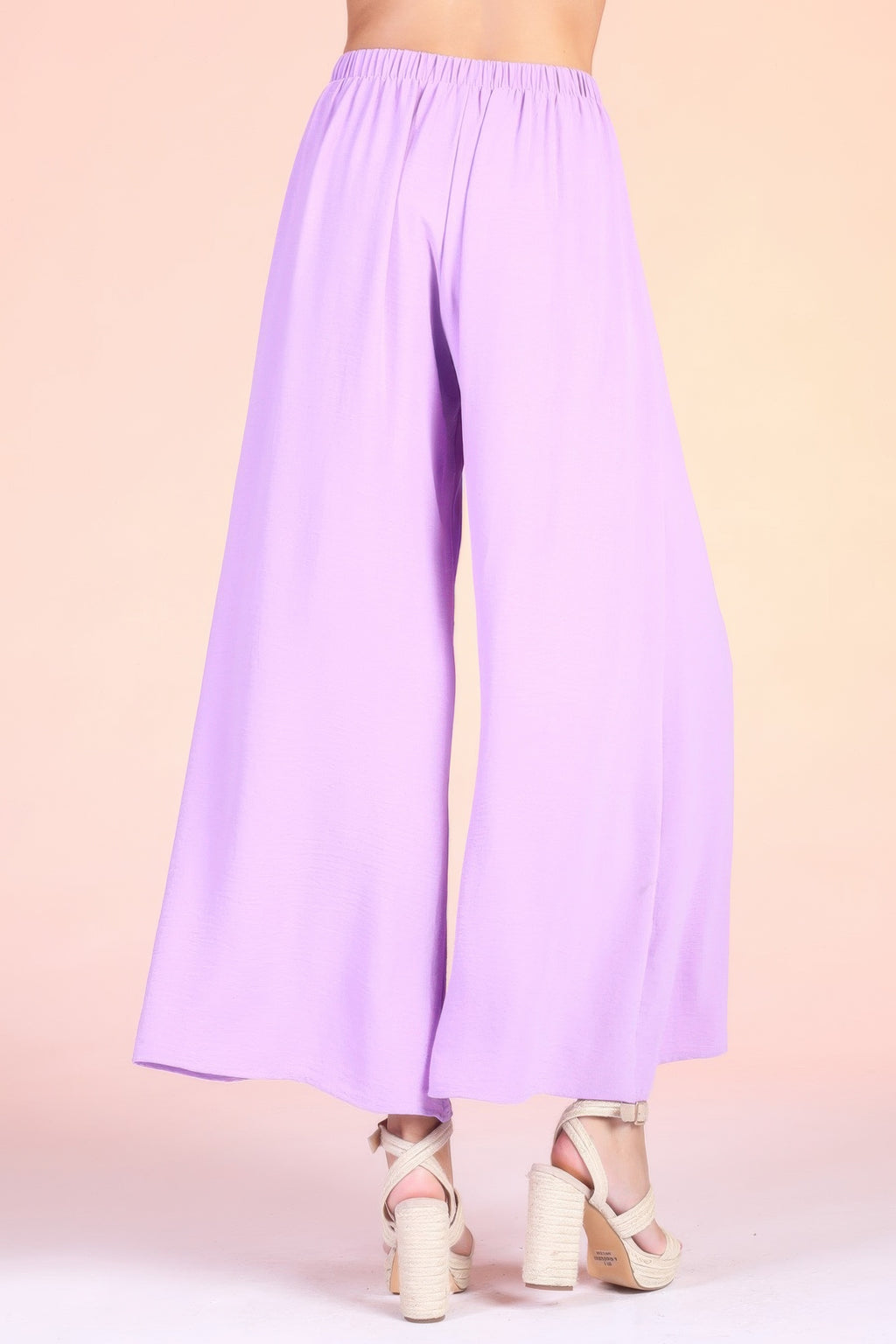 Lavender wide-leg swing pants with soft pleats at waist and wide, loose legs