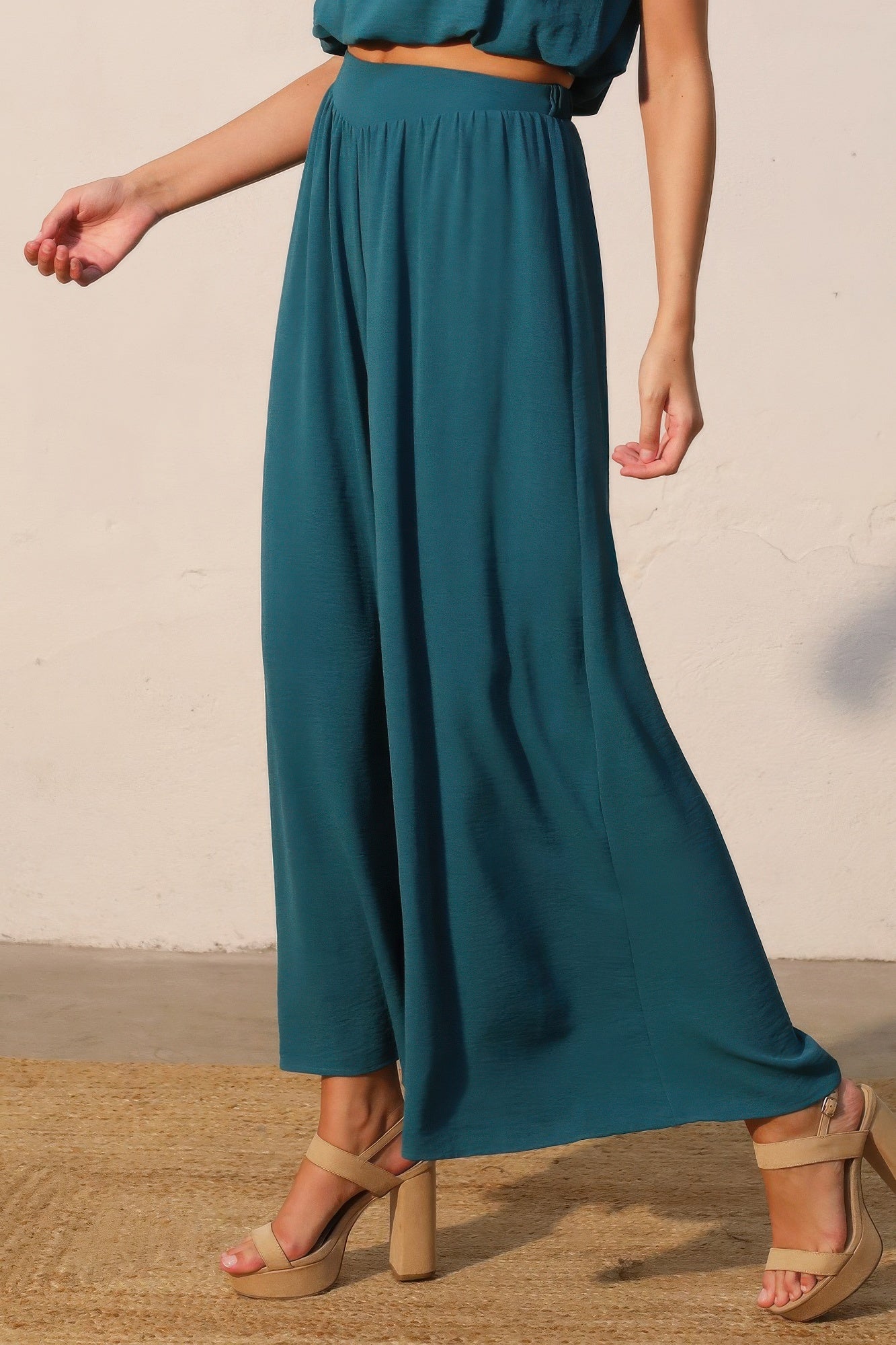 Teal matte crepe wide-leg pants with smooth fall and elastic waistband
