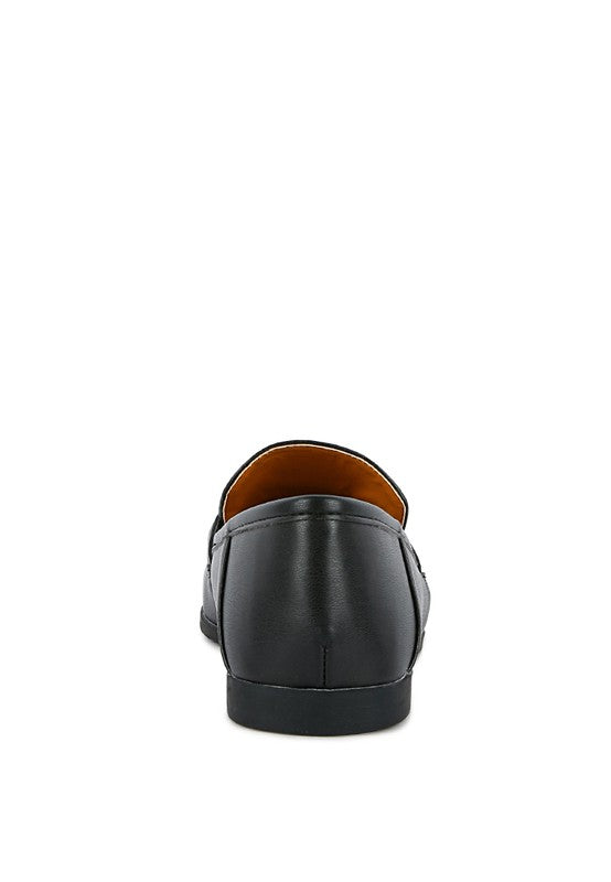 Black faux leather loafer back view showing heel seam and smooth upper.