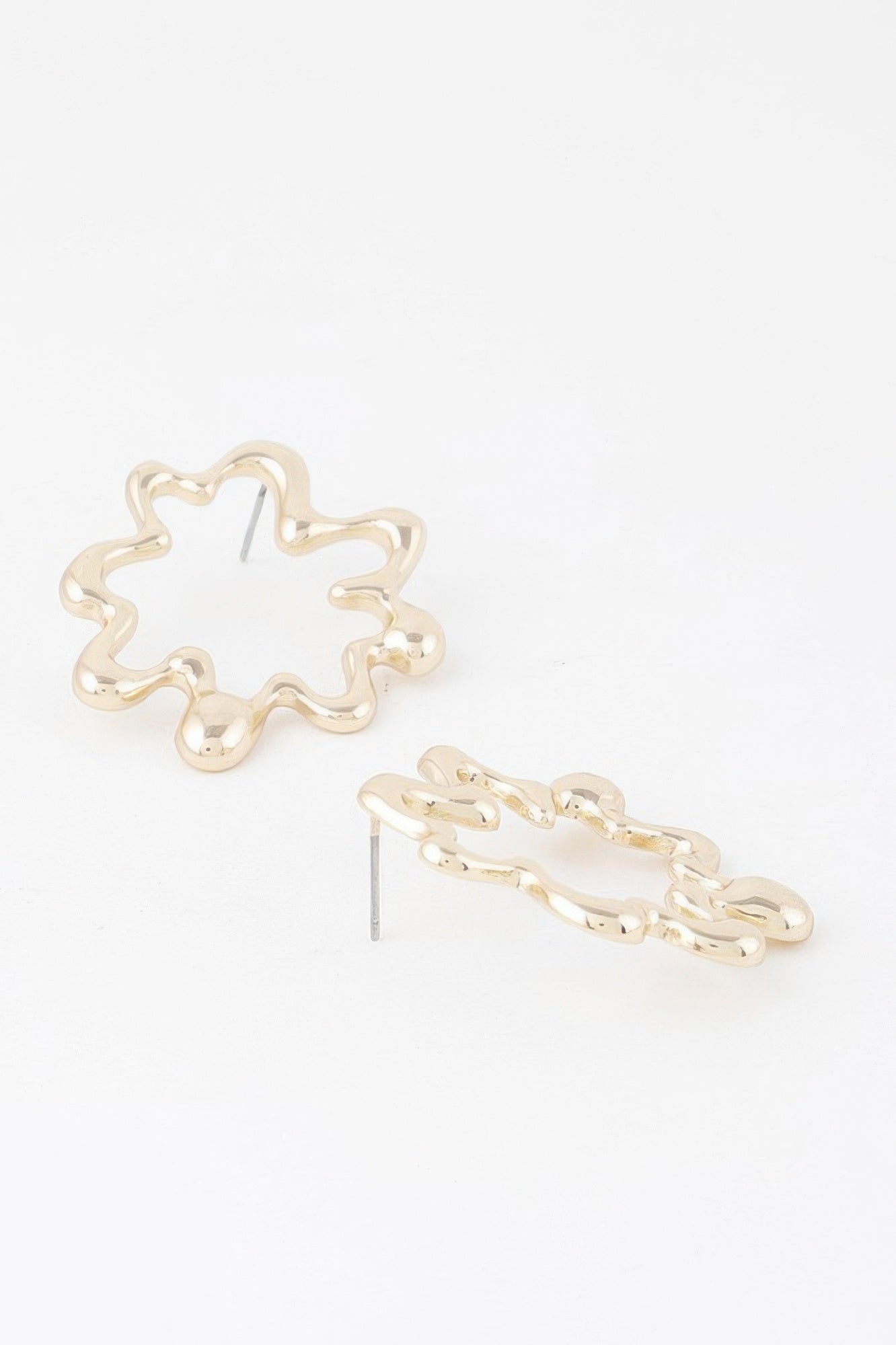 Melting circular hoop earrings, gold-tone with straight stud post, side view