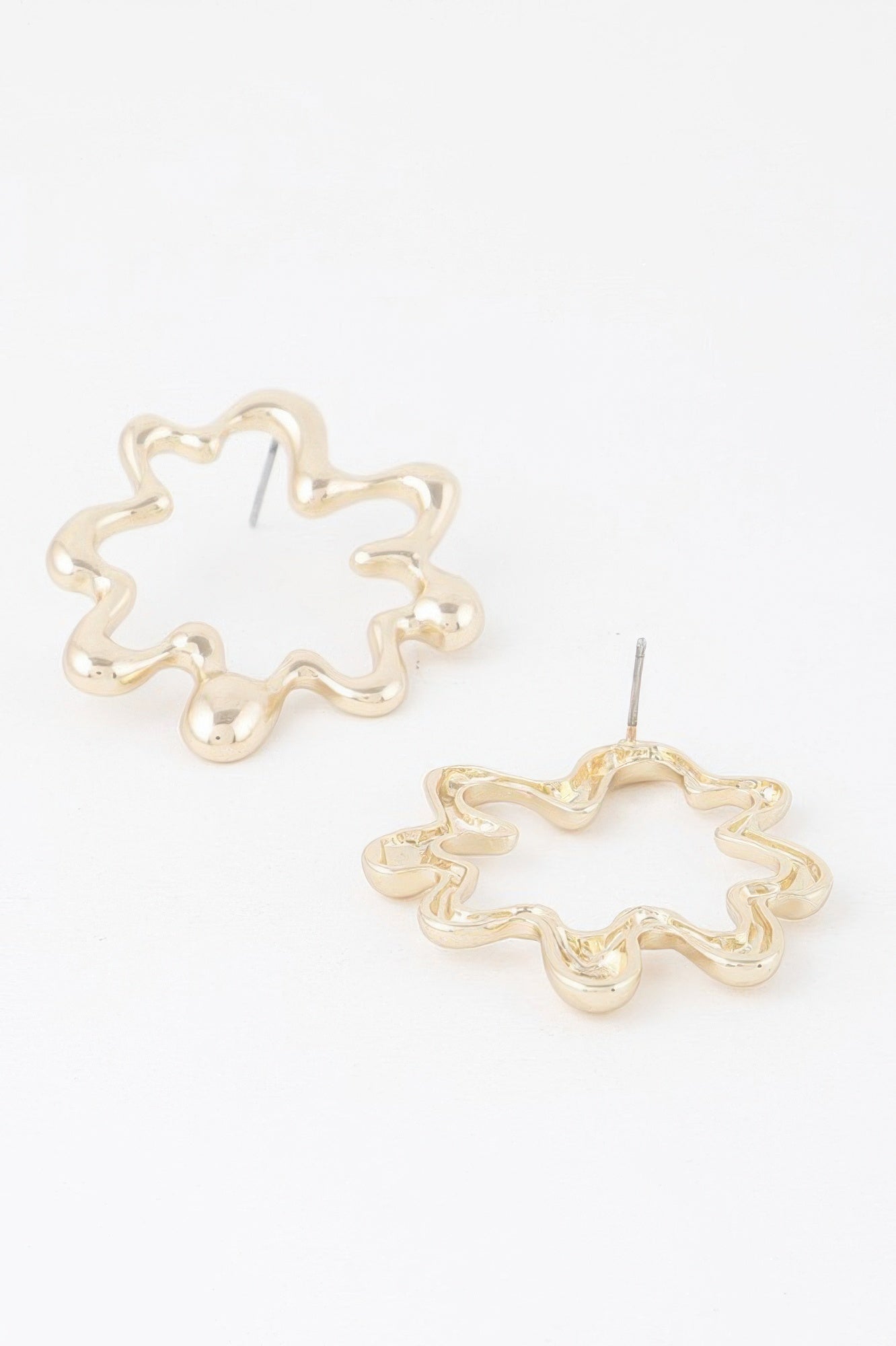 Melting circular hoop earrings, gold-tone pair with visible back stud pins