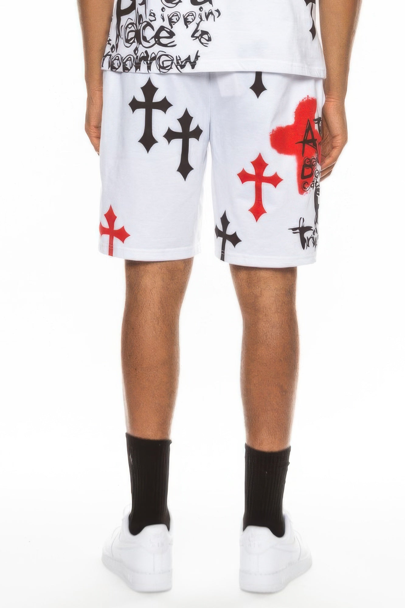 White knee-length shorts with red cross, black cross accents and skull-themed print