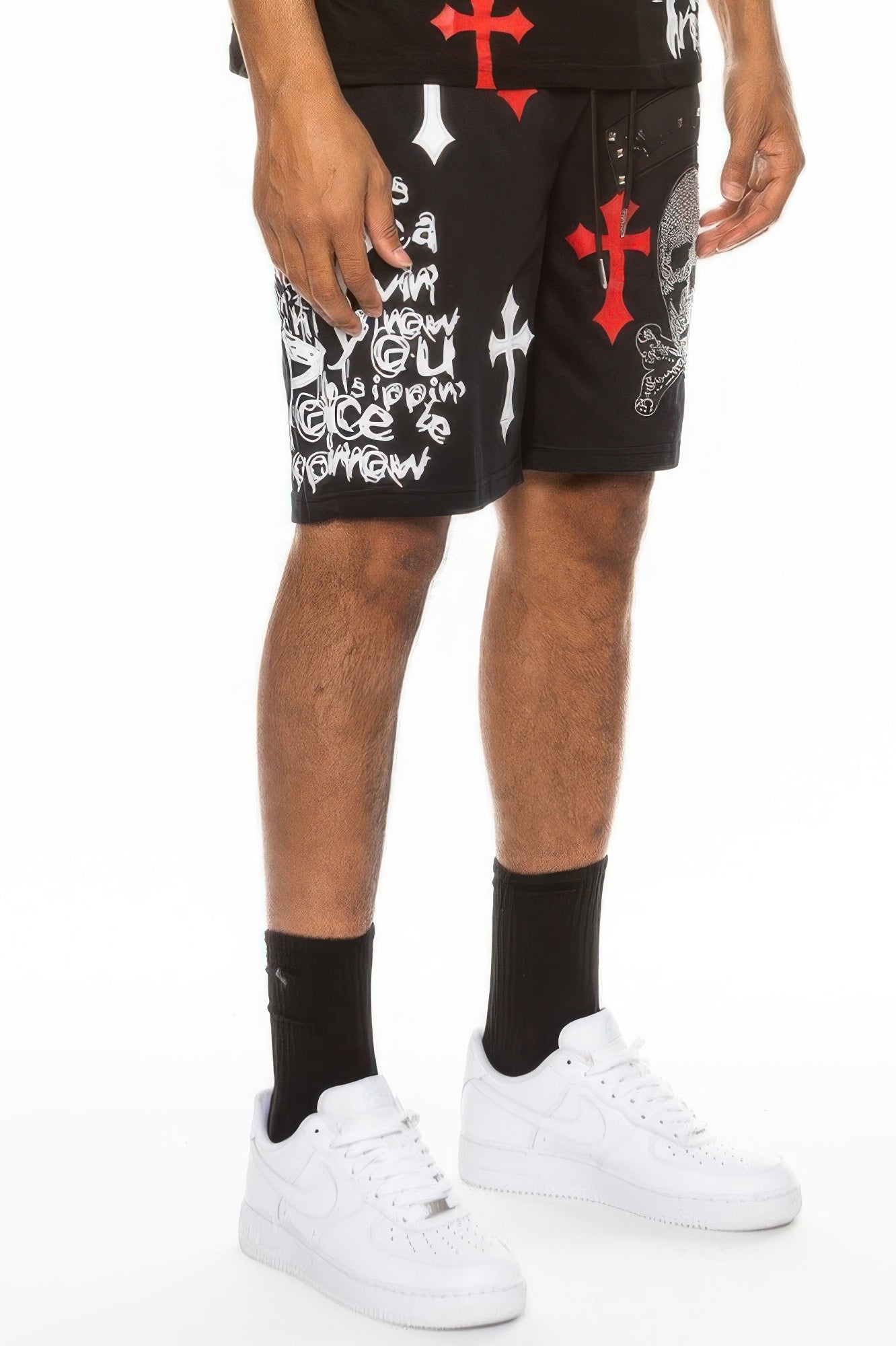 Black shorts with red and black cross prints and skull graphic, drawstring waist