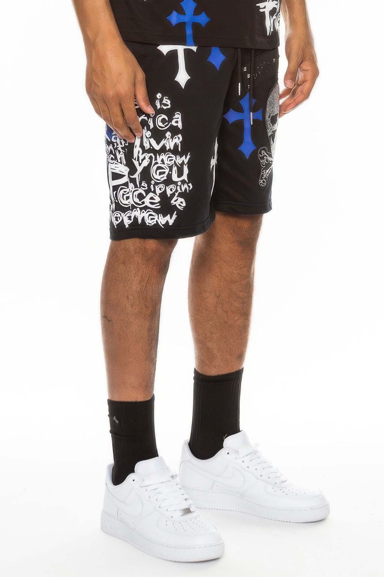Black shorts with blue and white cross motifs and skull-themed typography print