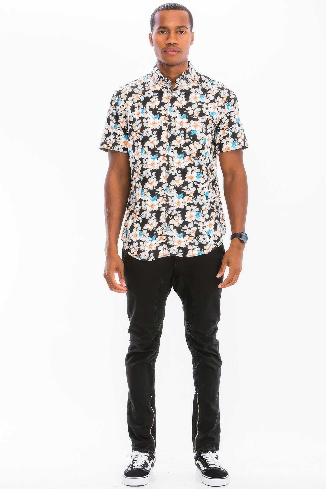 Men's black floral short-sleeve button-up, worn with dark pants
