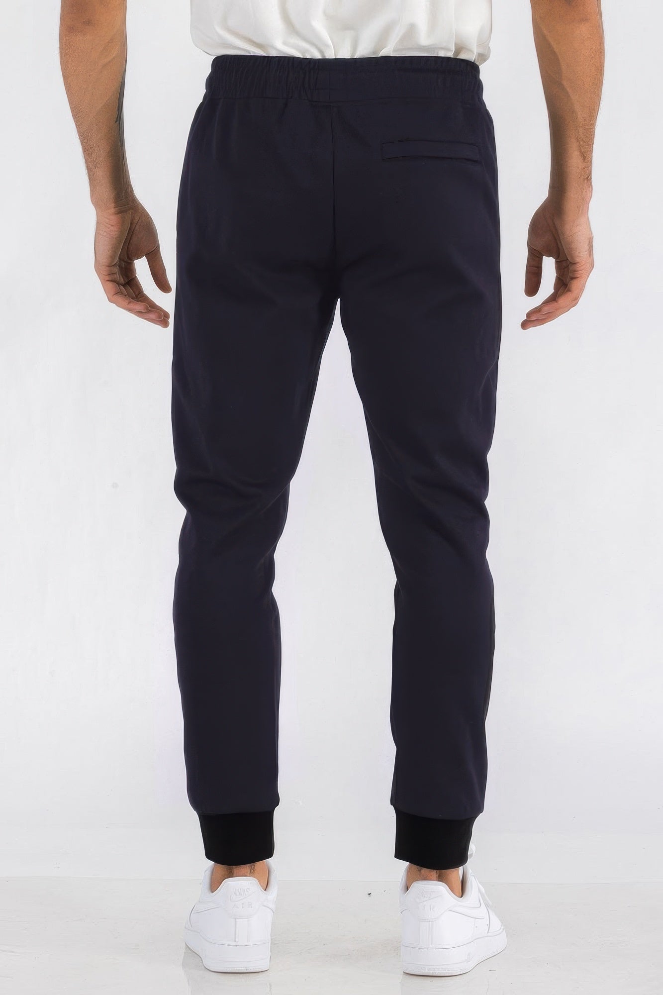 Mens solid jogger in dark navy, plain front with elastic waist and cuffed ankles