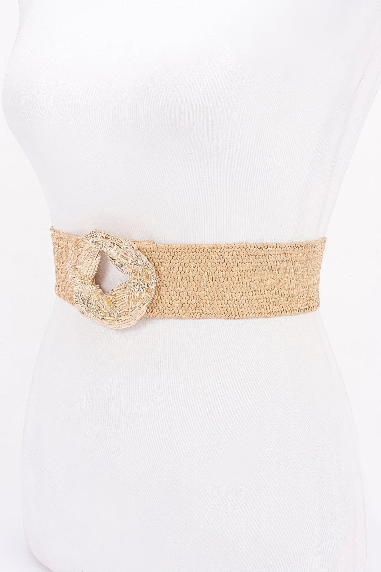 Beige elastic belt featuring a large oval gold-tone metal buckle