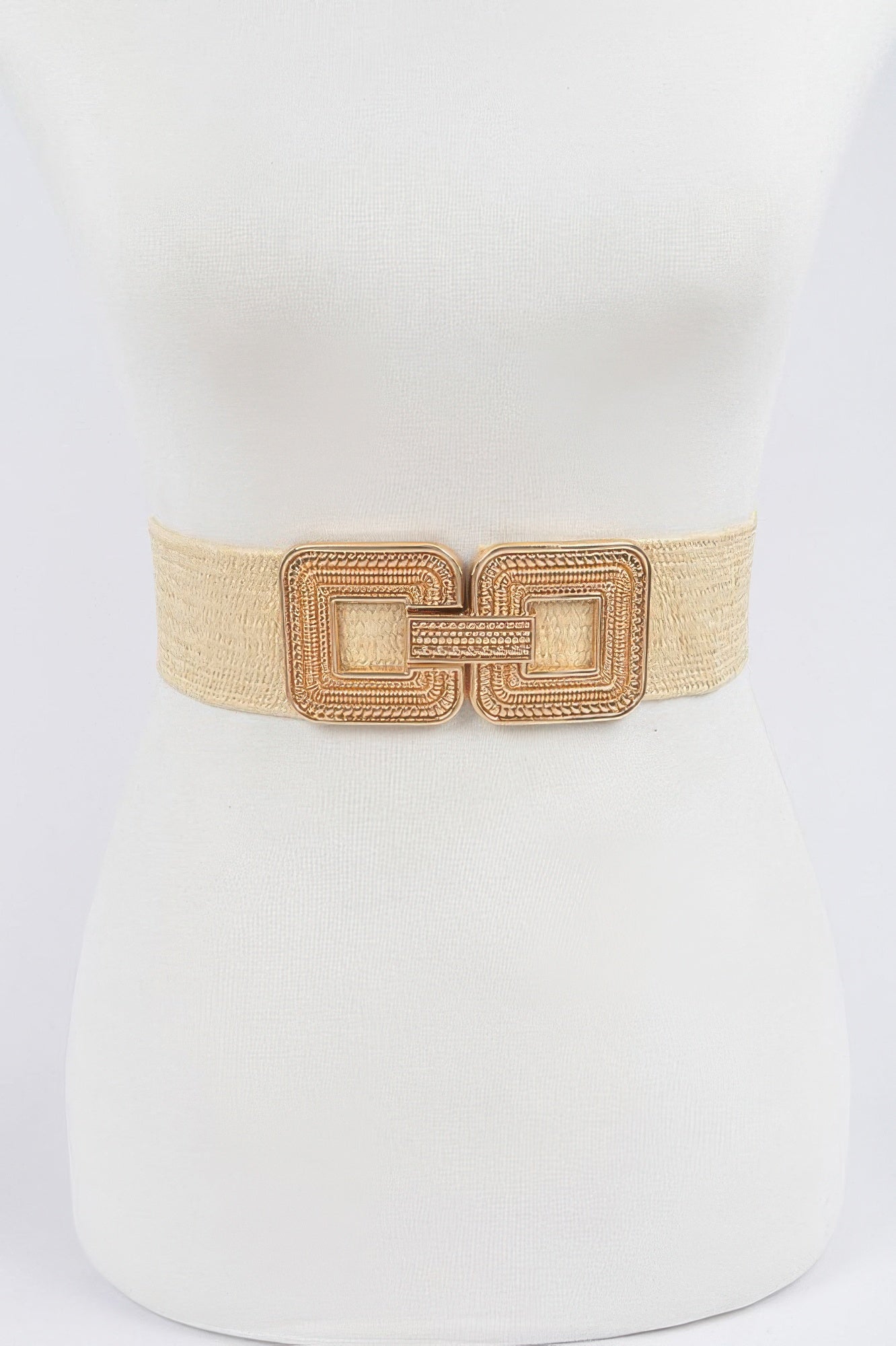 Beige elastic waist belt with ornate gold-tone square buckle detail