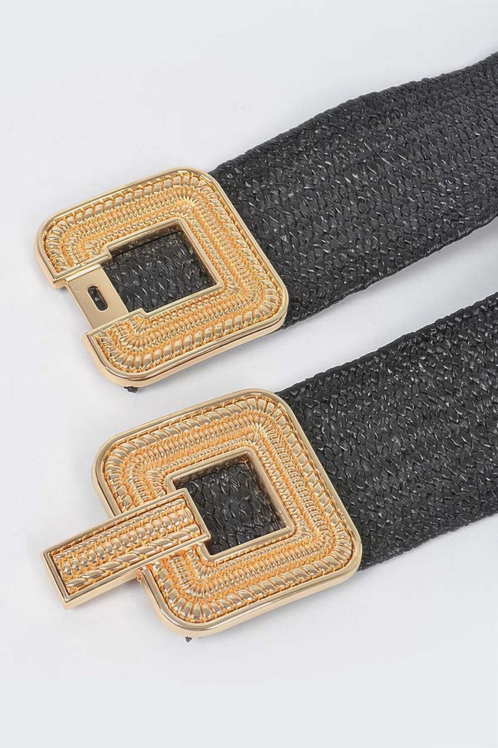 Gold-tone square buckle on black stretch belt with textured weave