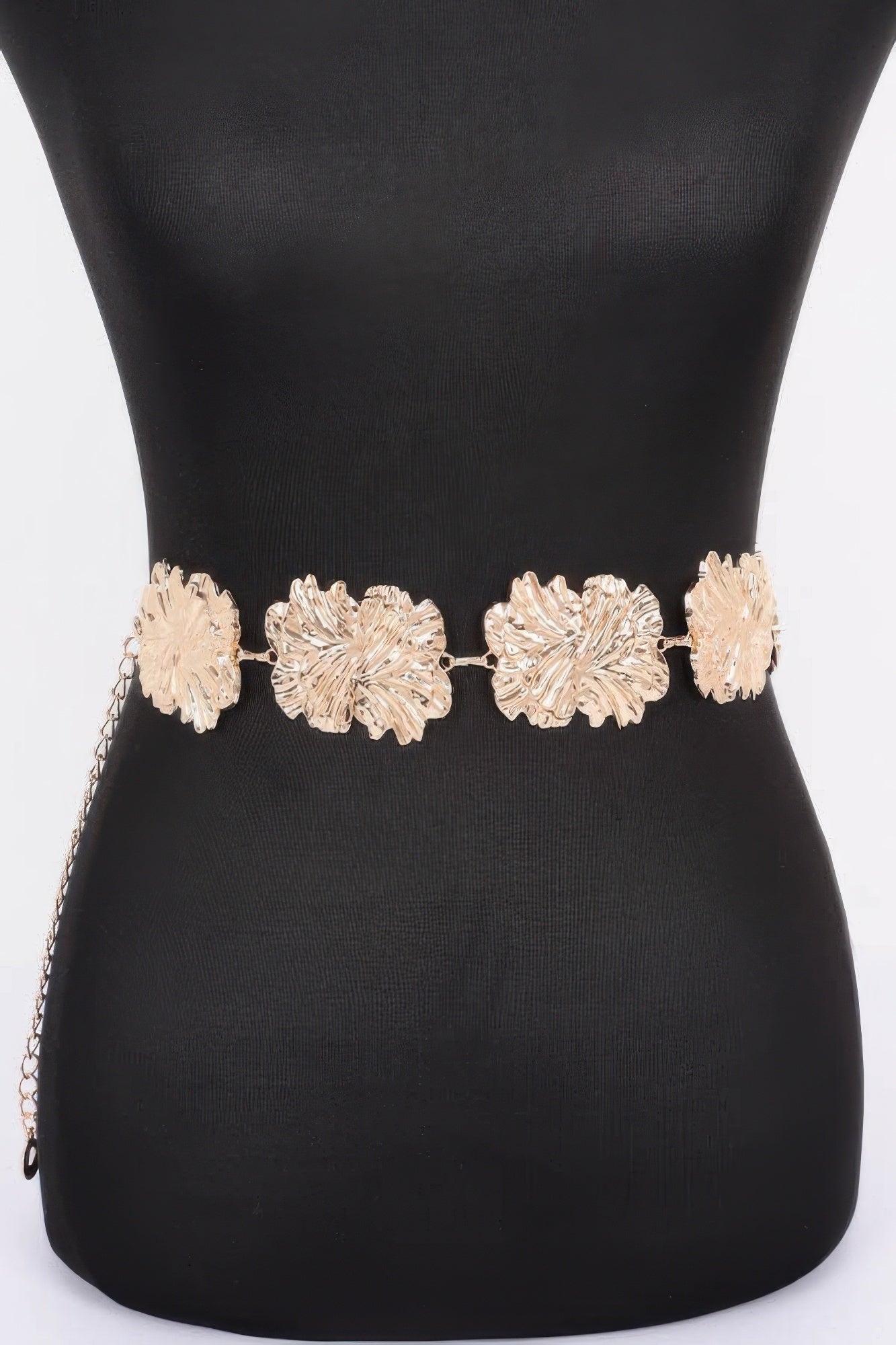 Gold metal chain belt with textured flower links, adjustable fit at waist