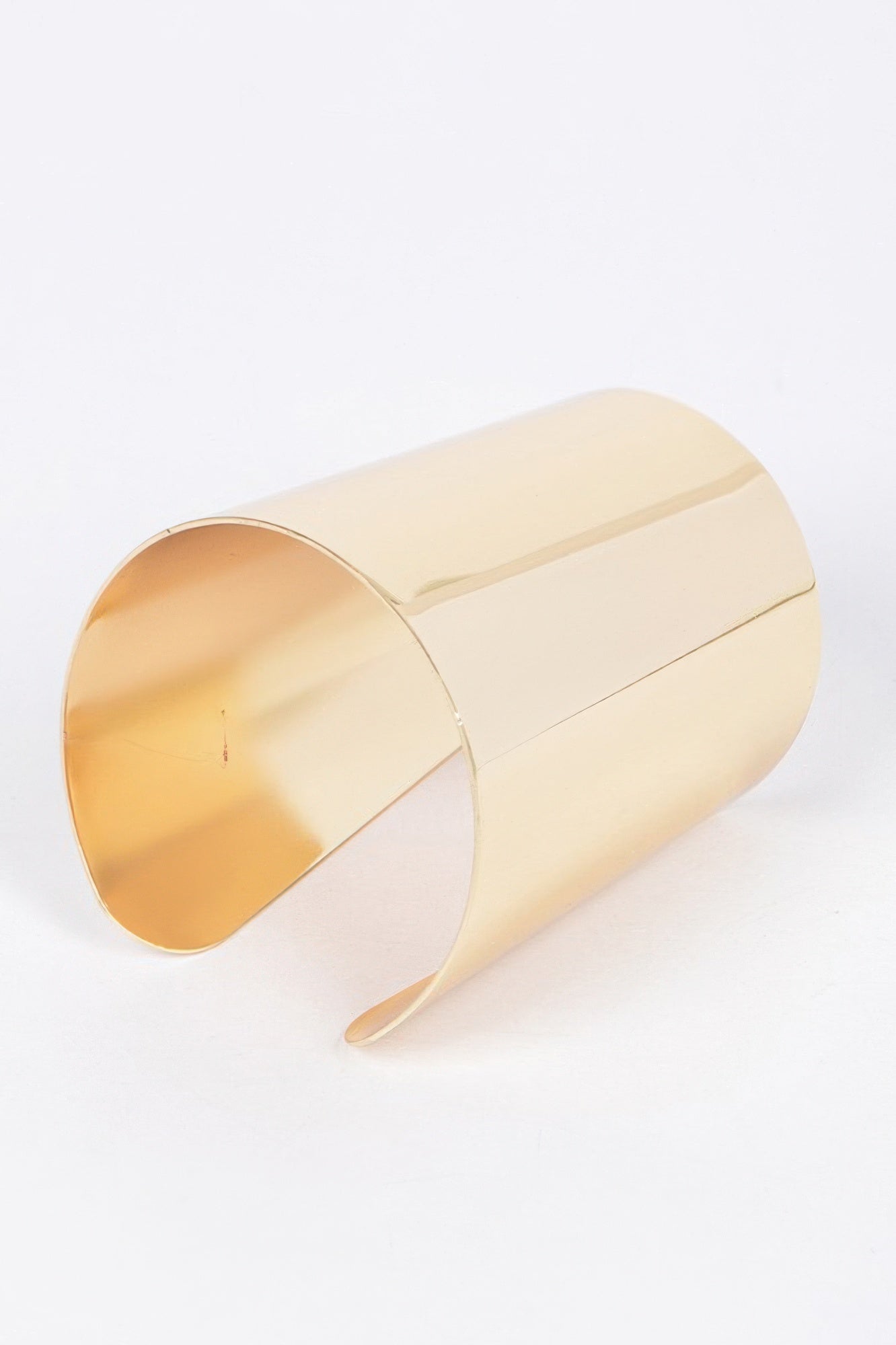 Gold metal cuff bracelet, curved wide bangle with inner opening tab detail