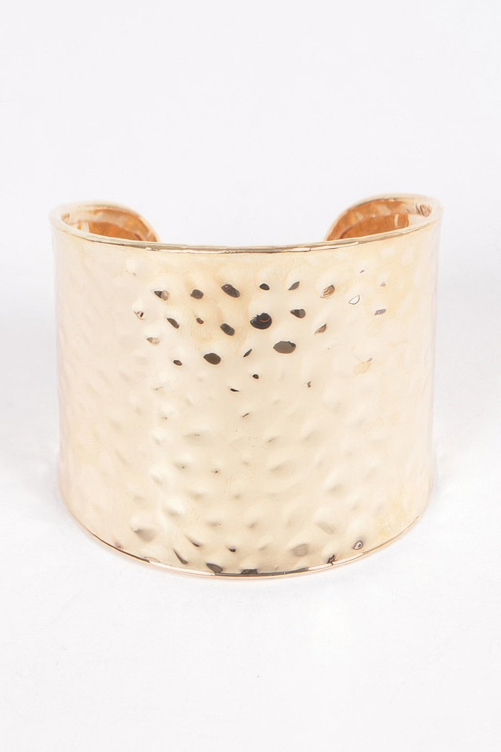 Metal cuff in Gold: wide hammered finish with small cutout dot pattern