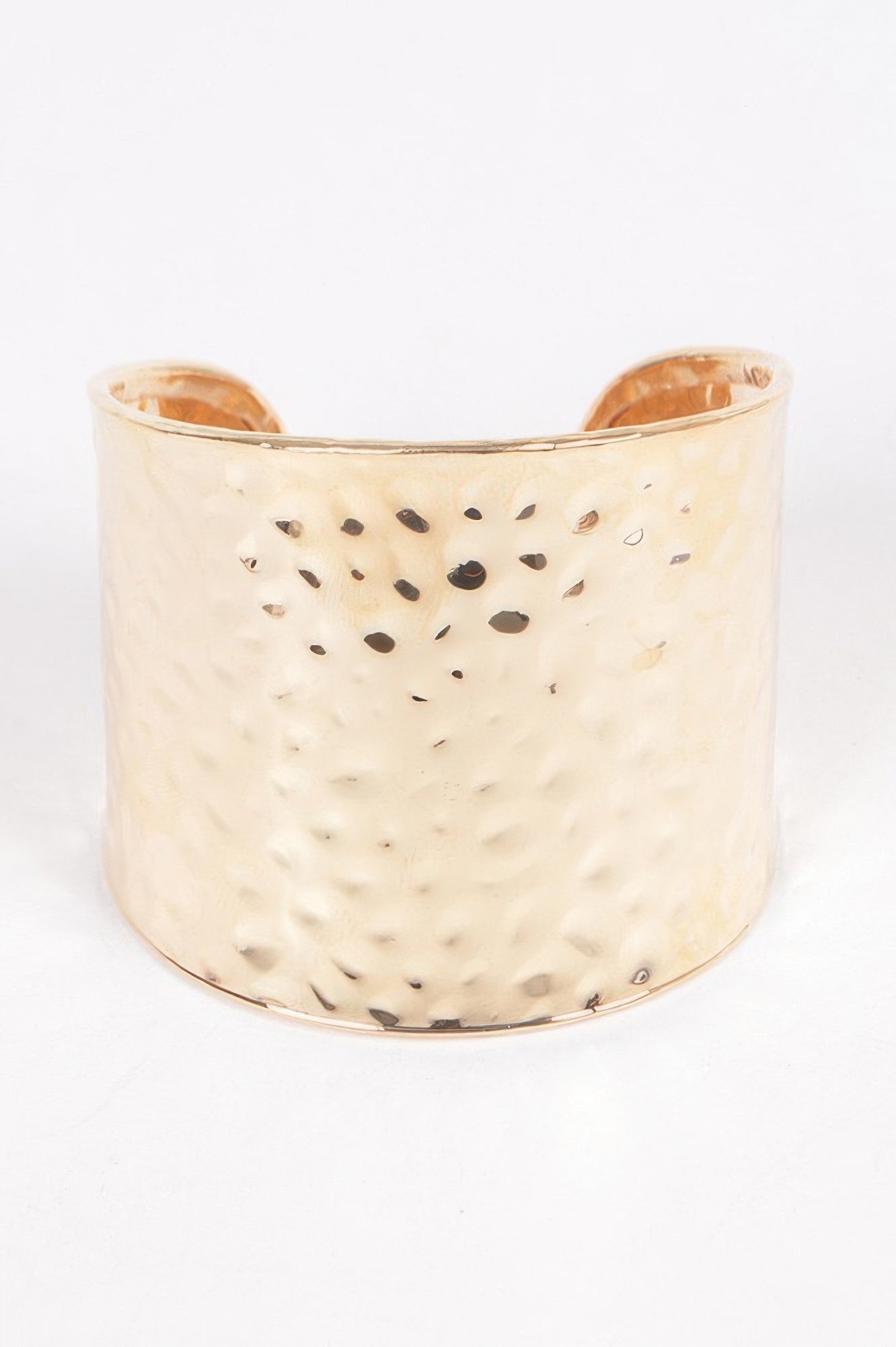 Metal cuff in Gold: wide hammered finish with small cutout dot pattern