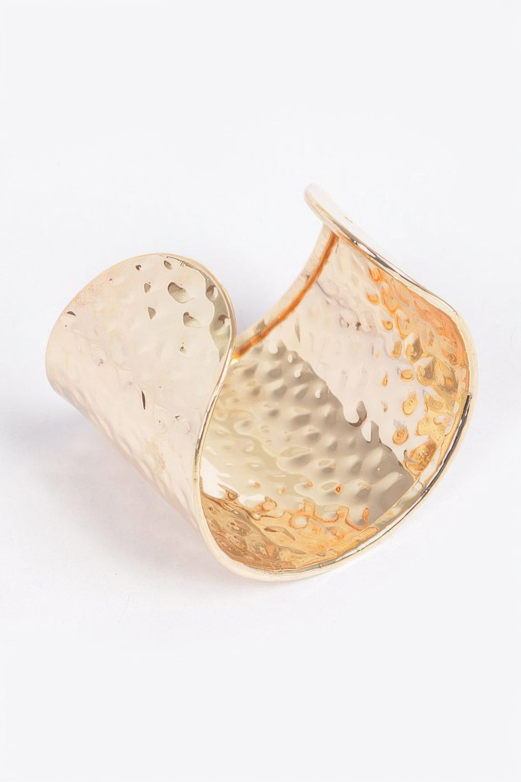 Gold metal cuff, open view: hammered texture with reflective inner surface