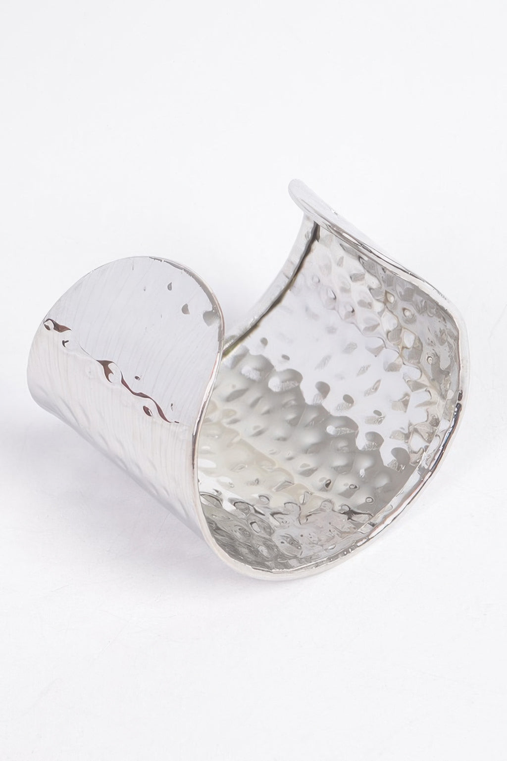 Silver metal cuff, open view: hammered shine with curved reflective inner side