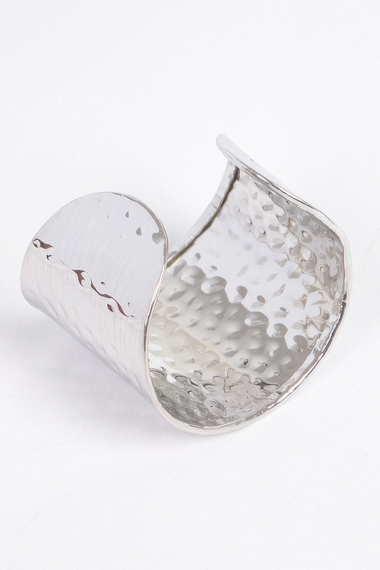 Silver metal cuff, open view: hammered shine with curved reflective inner side