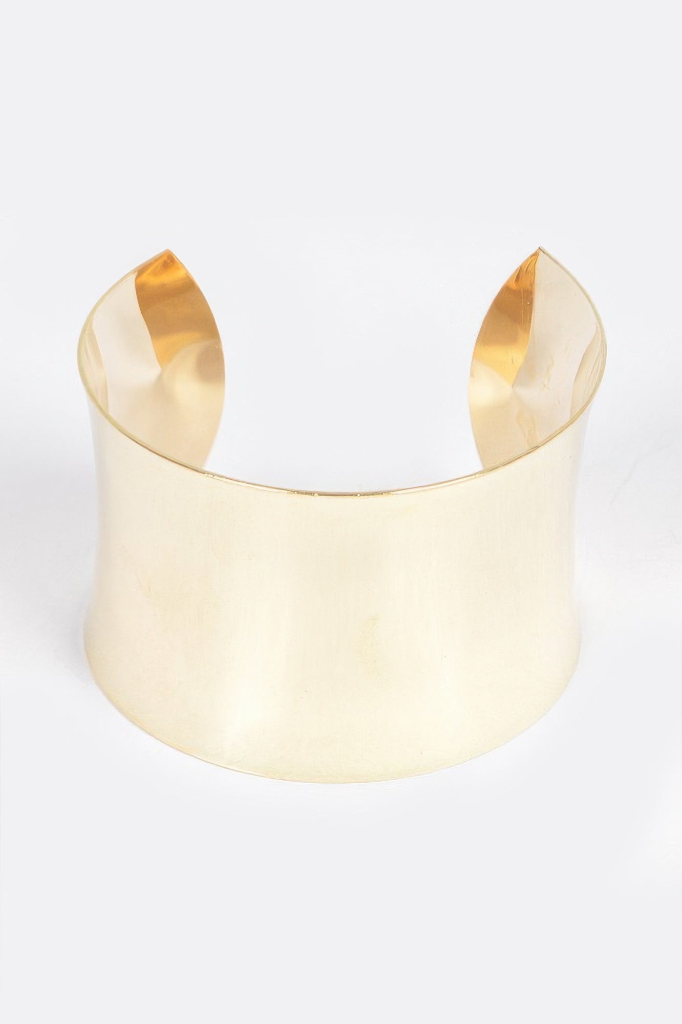 Gold metal cuff bracelet with wide open-top design