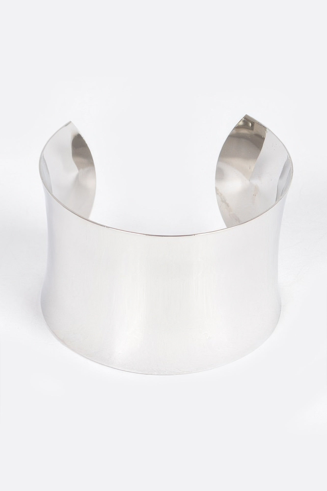 Silver metal cuff bracelet with wide open-top, reflective edges