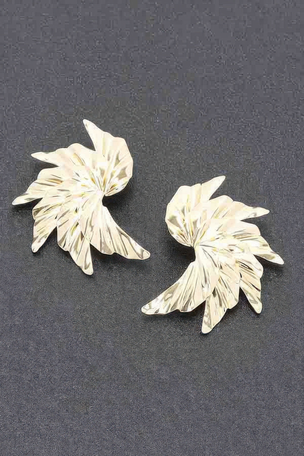 Floral metal earrings with ridged petal-style flower, gold tone