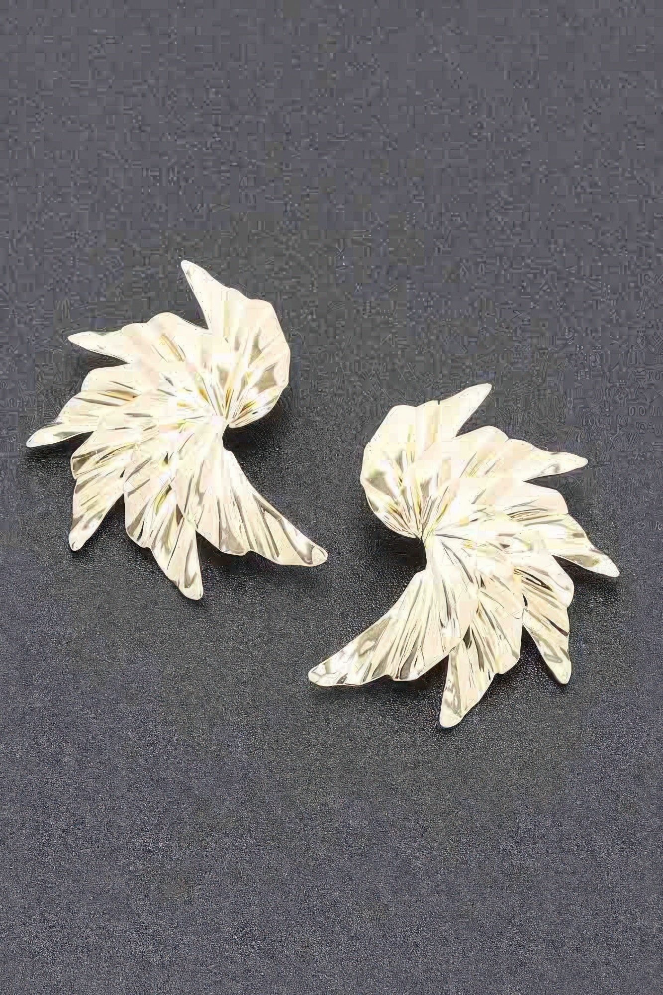Floral metal earrings with ridged petal-style flower, gold tone