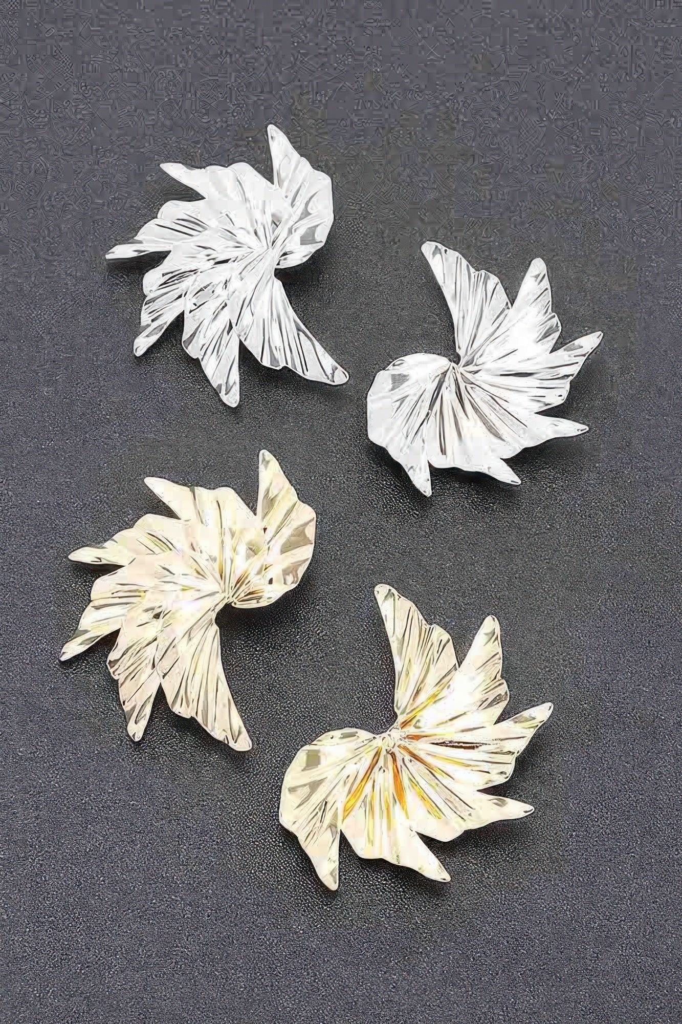 Set of silver- and gold-tone floral metal earrings with ridged petals